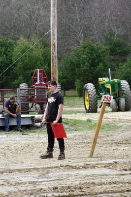 Rochester Tractor Pull
If you were anywhere near the Rochester Country Fair grounds on Saturday, you heard the familiar sounds of revving tractor engines echoing throughout the town. The country fair committee held a tractor pull/swap fundraiser on April 29. Those who attended got an early taste of the sights, sounds, and smells of the Rochester Country Fair with dirt flying, engines blasting, and diesel smoke billowing up into the air. Photos by Jean Perry
