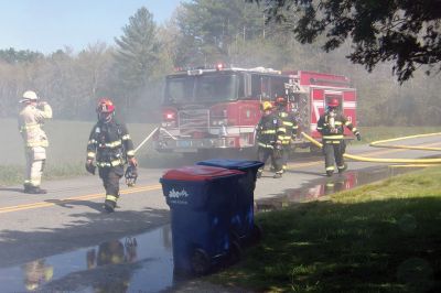 Trash Fire
A trash truck was up in smoke on Long Plain Road in Mattapoisett last week. Before I knew it, engines and firemen appeared in full gear. The Fire Department had the driver dump all the trash in a field near the road where the fire could be more safely extinguished. Photo by Ellie Higgins
