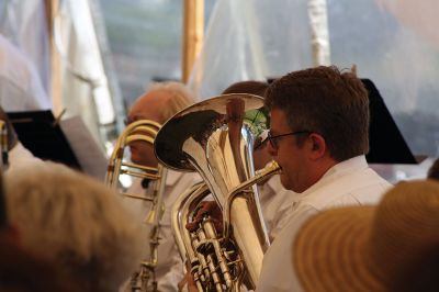 Tri-County Symphonic Band
The Tri-County Symphonic Band, under the direction of Philip Sanborn, hosted its 14th Annual Benefit Pops Concert beneath a breezy tent on the grounds of Tabor Academy on Sunday, June 12. This year’s concert had the appropriate theme “Celebration of the Sea,” and event-goers delighted in ocean-themed songs (and cupcakes) with Sippican Harbor as the backdrop. Photos by Jean Perry
