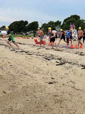 Mattapoisett Triathlon
The Mattapoisett Triathlon took place on Sunday, July 27. The event, hosted by the Mattapoisett Lions Club, saw over 100 competitors begin from Town Beach, swim 0.25 miles, bike 10 miles north of town and back, and finally run a 5K past Ned’s Point and back around to the beach. Photo by Robert Pina
