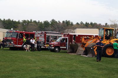 Second Annual Kid’s Equipment Day
Little kids and big, big machines on a warm spring Marion morning made for tons of fun at the Marion Recreation’s Second Annual Kid’s Equipment Day on May 10. A row of different Town-owned vehicles including a police cruiser, ambulance, earth diggers, a fire engine, and fire trucks lined the Town House field. There were plenty of Department of Public Works, police, and fire personnel on hand to demonstrate how the vehicles work, to turn on lights and alarms, and answer questions. Photo by Jean Perry
