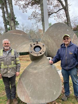 Tugboat propeller installed with flagpole for memorial in Rochester. Paul Ciaburri (right) and friend and welder Steve St. John (left). Photo by Marilou Newell. November 7, 2024 edition
