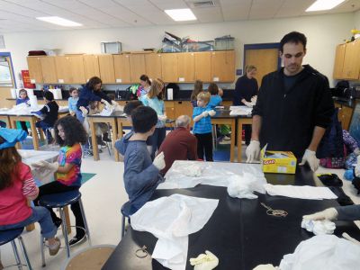 Tie Dye Fun
Students at the Marion Natural History After School Program learned about chemical reactions and colors during a tie-dye shirt-making session held this past week with UMass Dartmouth Chemistry Professor Tobey Dills. Photo courtesy of Elizabeth Leidhold
