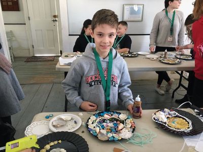 Victorian Sailor Valentines
The Mattapoisett Land Trust, in partnership with the Mattapoisett Museum, held a craft event featuring how to make Victorian Sailor Valentines from shells and other materials. Before the crafting began, more than 20 children learned that these creations were originally fabricated in Barbados by English women living there. The “Valentines” were sold as tourist items. Photos by Marilou Newell and Kyle DeCicco-Carey
