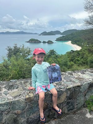 Trunk Bay in St. John 
5-year-old Payson Langlois of Mattapoisett at Trunk Bay in St. John with his copy of The Wanderer. Voted #1 beach in the world in 2024.
