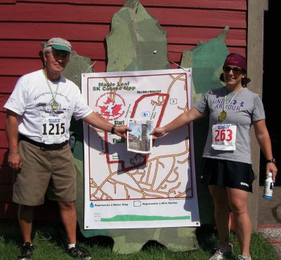 Maple Leaf Half Marathon 
L. to R. Joe Murray, President of Mattapoisett Lions Club and Amy (Rose) Herrmann, formerly of Mattapoisett, now of Manchester Center, VT at the Maple Leaf Half Marathon and 5K Race in Manchester, VT on September 10, 2011 where Joe completed the 5K while Amy did likewise in the fun 13.1 K Half Marathon. The Manchester, VT Lions Club. Inc. is a major sponsor of this annual event.
