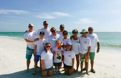 Siesta Key 
This year the O’grady/Wheeler’s celebrated our 10th year of the trip to Siesta Key and our photo includes custom t shirts for the trip and of course The Wanderer. Our Family all included is The O’grady/Wheeler’s, The Wrights, The Barry’s, and the DaLuz’s. Photo from the Back Left: Pat Ogrady & Jim Wheeler and Dave Wright, Photo from the Middle Left: Georgie Barry, Michelle Barry, Jocelyn DaLuz, Lisa Wright, Alex Wright & Dan DaLuz. Photo from the Front Left: Claire Barry, Charlie Barry & Maddie Wright.
