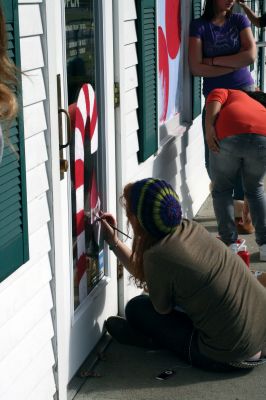 Holiday Windows
Art students from Old Rochester Regional High School work under Ms. Dorothy's guidance to decorate Plumb Corner storefront windows on November 17, 2009. The students took a couple hours away from books to enjoy some paint and sunshine. The festive windows will be on display until Christmas. Photo by Anne O'Brien-Kakley.
