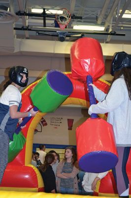 Winterfest
ORRJHS hosted a fun Friday night for Grades 6-8 on January 19, providing a ‘Winterfest’ to break up the chilly season with some heated up fun, such as dancing to a DJ, disco lights, and an inflatables room complete with jousting, bouncing, and inflatable sumo wrestling. And don’t forget the cocoa, cookies, and cotton candy, which took on a snowy-like life of its own as 12th grade AmbassadORs tried to keep up with the supply … and demand. Photos by Jean Perry
