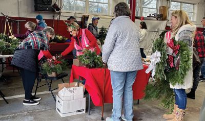 Mattapoisett Woman's Club
Inclement weather forced the Mattapoisett Woman's Club to move its Holidays Wreath and Greens Sale indoors, and the club was thrilled that the December 3 event, with the assistance of MWC members Cindy Turse and Sandy Hering, Fire Chief Andy Murray and Town Administrator Mike Lorenco, was able to go on as scheduled in the Old Firehouse on Route 6. Wreaths sold out within the first hour of the sale, with swags, table pieces, box designs and special ornaments, all exquisitely hand-decorated 
