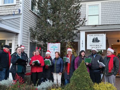 2024 Marion Christmas Stroll 
The 2024 Marion Christmas Stroll took place on December 8. Pictured are Carolers outside The Sippican Historical Society (top), Mr. and Mrs. Clause riding their carriage on Front Street (left), and Santa arriving by tugboat (bottom). Photos by Sam Bishop and Mick Colageo.
