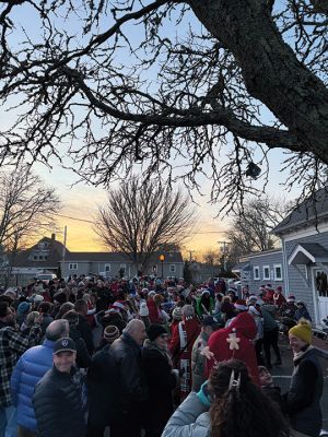 2024 Marion Christmas Stroll 
The 2024 Marion Christmas Stroll took place on December 8. Pictured are Carolers outside The Sippican Historical Society (top), Mr. and Mrs. Clause riding their carriage on Front Street (left), and Santa arriving by tugboat (bottom). Photos by Sam Bishop and Mick Colageo.
