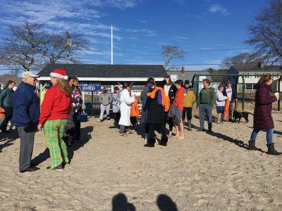 Christmas Day Swim
The 16th Annual Christmas Day Swim for Helping Hands and Hooves took place under bright blue cloudless skies and a balmy 43 degrees as dozens of families and friends took the plunge at Mattapoisett Town Beach. Photos by Marilou Newell
