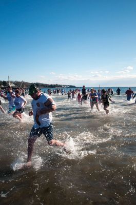 2015 Freezin’ for a Reason Polar Plunge
The 2015 Freezin’ for a Reason Polar Plunge on New Year’s Day at Town Beach in Mattapoisett was a splashing success, according to event coordinator Michelle Huggins. The third annual polar plunge raised nearly $10,000 to provide financial assistance to local families battling cancer. Many participants donned costumes, competing for the best costume trophy.  Photo by Felix Perez
