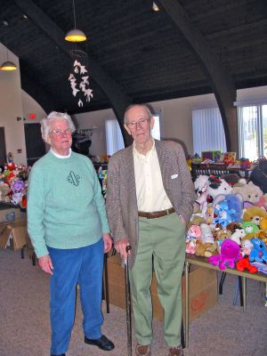 Renewing Toys and Dreams
Community volunteer Betsy Duncan poses with Hyde Gillette amidst her latest batch of reconditioned toys at Saint Gabriels Parish Hall in Marion. Ms. Duncan credits Mr. Gillette and her parents with inspiring her to start the Marion Toy Project which shes run for the past 16 years. The annual program will mark its final year this holiday season as Ms. Duncan and her volunteers plan to retire. (Photo by Nancy MacKenzie).
