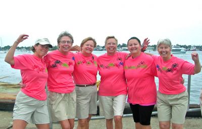 The Crab-a-Lots
Members of the tri-town based Womens Master (Blue Whale) Crab-a-Lots rowing team recently took part in the Buzzards Bay Rowing Clubs First Annual Whaleboat Races held during the Working Waterfront Festival in New Bedford on September 23. The dancing Crab-a-Lots were voted the most energetic team and the one showing the most team spirit with their personally painted crab t-shirts and crab-like dancing to the music of the band.
