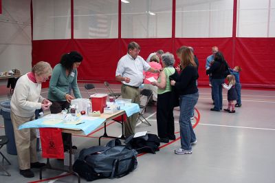 Flu Clinic
(from left) Board of Health member Betsy Dunn, volunteer Pamela Evans, and Dr. John Howard prepare to administer flu vaccinations to a family during the recent Marion Flu Clinic held at Tabor Academy on November 8. (Photo by Robert Chiarito).
