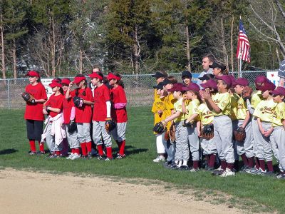 Mattapoisett Opening Day 2007
Opening Day Ceremonies for the 2007 season of Mattapoisett Youth Baseball (MYB) included special guests and local legends such as former American Idol contestant Ayla Brown, who sang the National Anthem and threw out the ceremonial first pitch, and former Boston Red Sox pitcher Brian Rose. The day also included a tribute to longtime MYB supporter and former Mattapoisett Recreation Director John Haley with the field at Old Hammondtown School in his honor. (Photo by Robert Chiarito).
