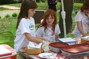 Hannah Charron, left, and Emily Wheeler, right take inventory of their baked goods.